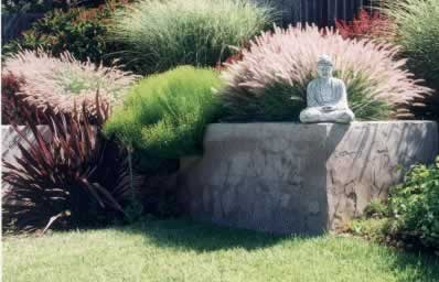 The eye focuses on the sculpture; the dominant feature of the garden.